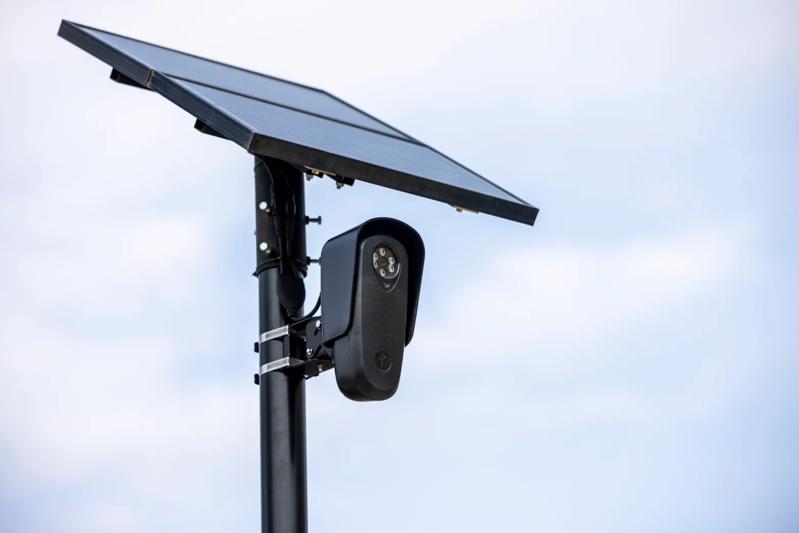 A Flock Safety ALPR camera on a pole against the sky in Anna, Texas